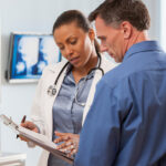man talking to woman doctor